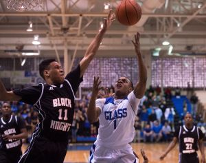 Tyreek Ragland playing defense against EC Glass's Rameek Vereen. 